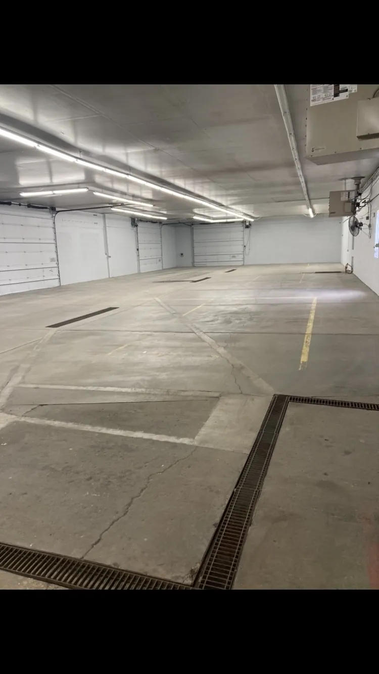 Flake epoxy floor in a commercial shop with floor drain