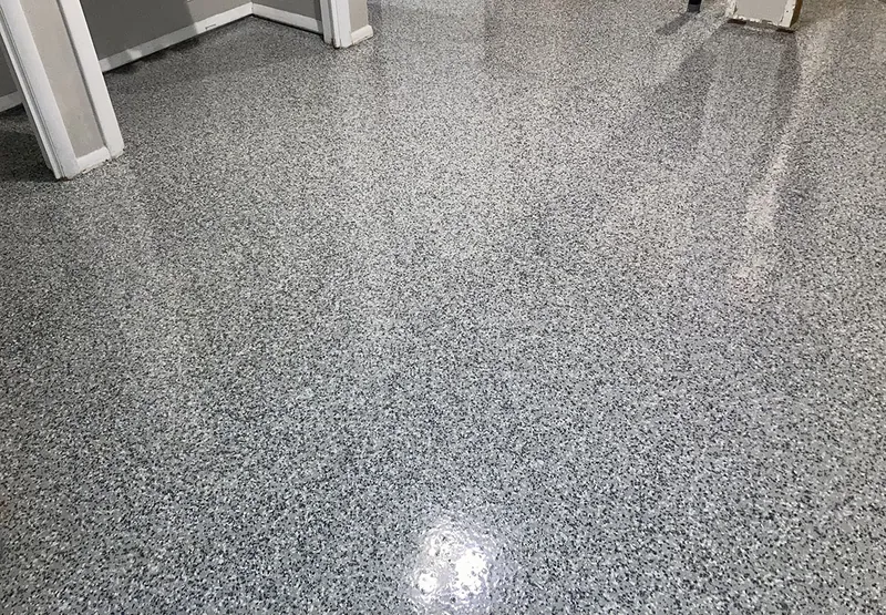 Flake epoxy garage floor at the entry door