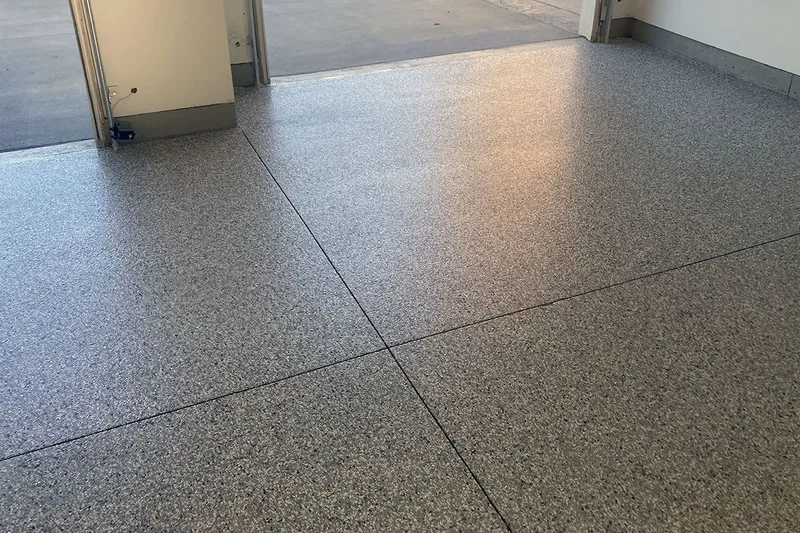 Flake epoxy garage floor with door open