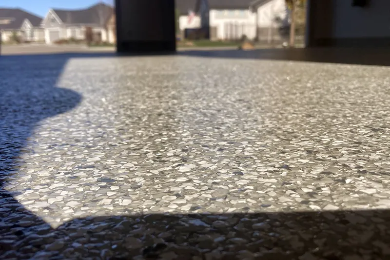 Flake epoxy floor edge at the driveway