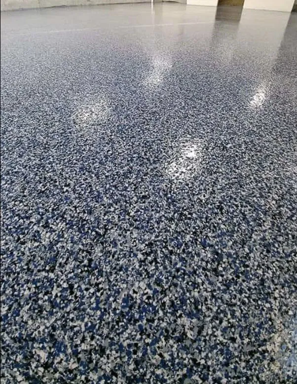 Close-up of blue and gray flake epoxy floor