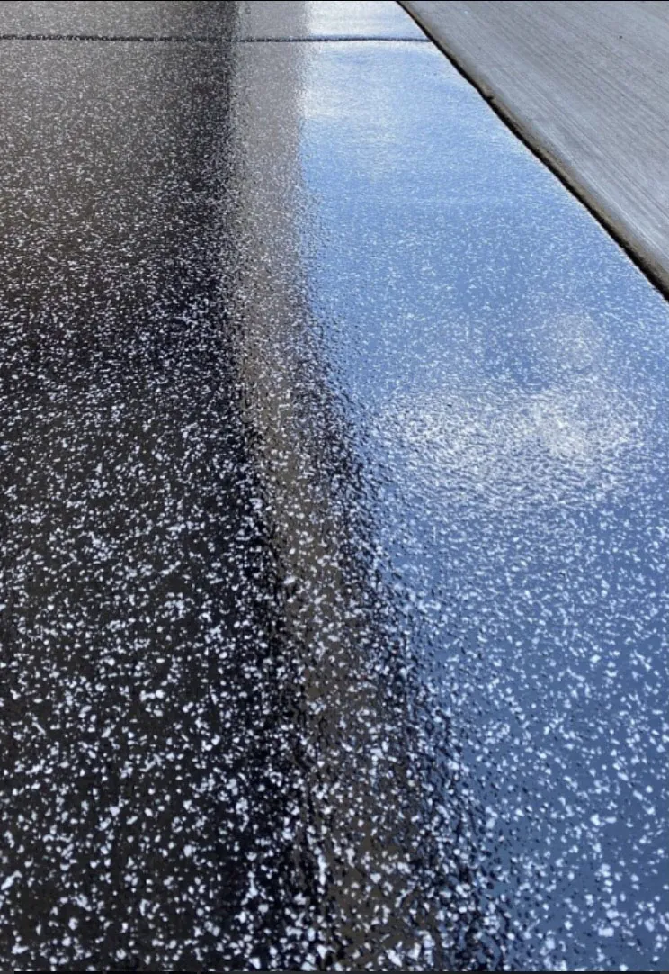 Close-up of blue and black flake epoxy floor