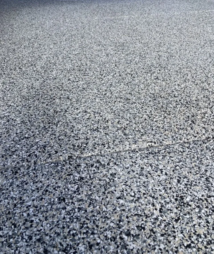 Close-up of gray flake epoxy floor