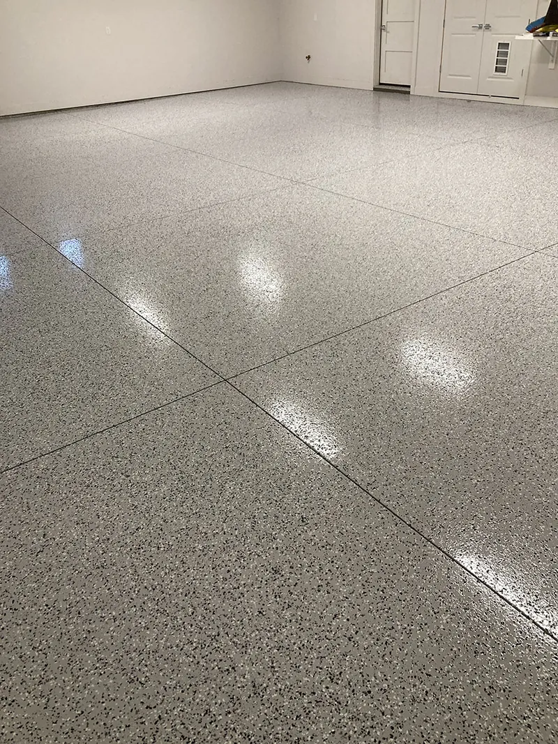 Flake epoxy garage floor with the door open