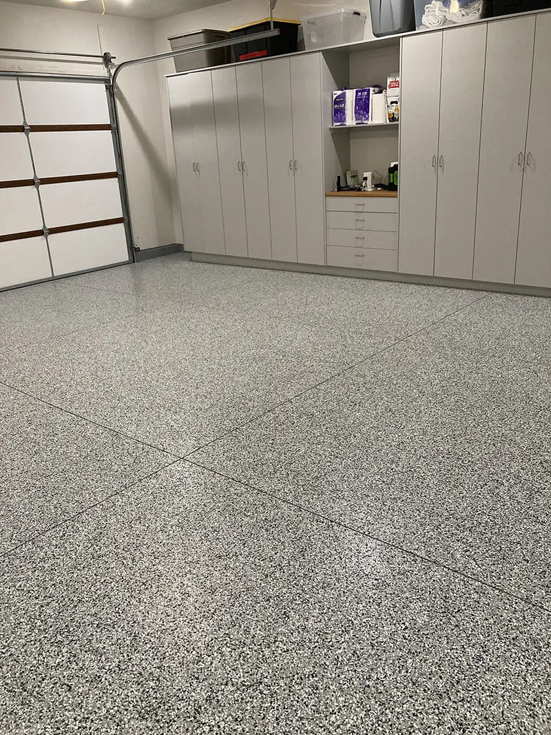 Flake epoxy garage floor with built-in cabinets