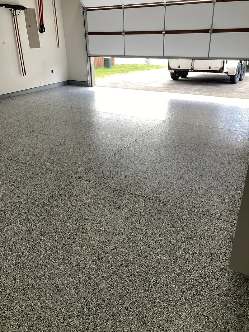 Flake epoxy garage floor at the door