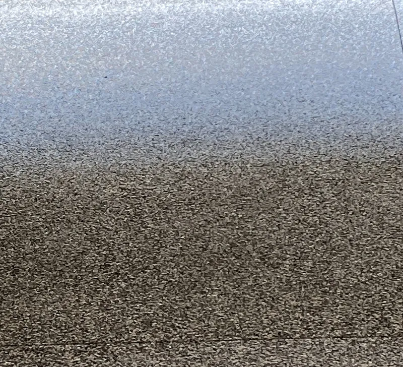 Close-up of gray and brown flake epoxy floor