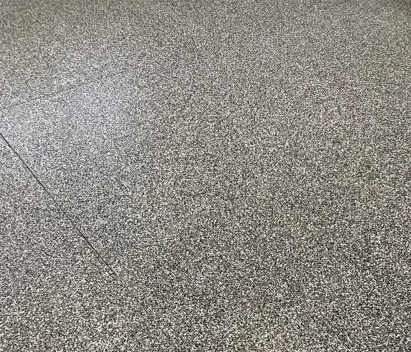 Flake epoxy floor detail with glossy topcoat