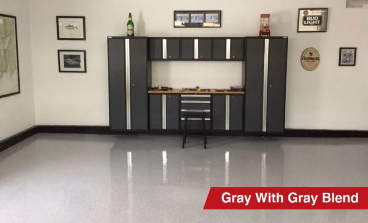 Gray epoxy garage floor with Gray flake blend and storage cabinets
