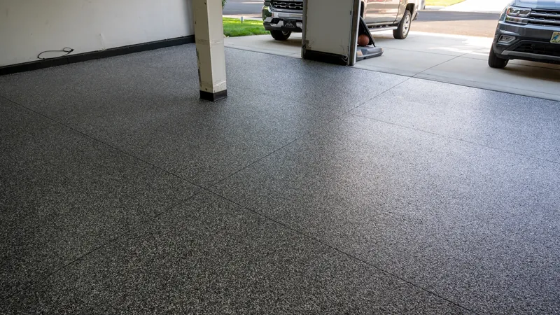 Flake epoxy floor in a commercial shop with vehicle lift