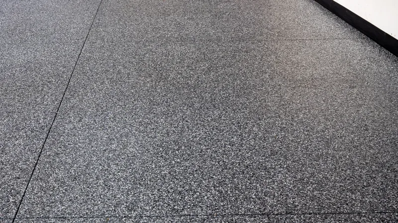 Flake epoxy floor detail in a commercial shop